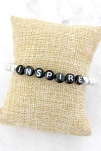 Black Tiled Letter 'Inspire' Worn Silvertone Bead Bracelet